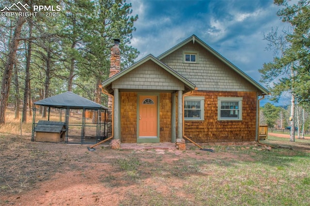 view of front of house with an outbuilding