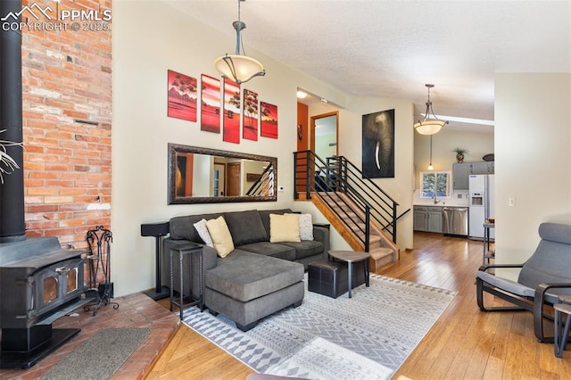 living room featuring hardwood / wood-style flooring and a wood stove