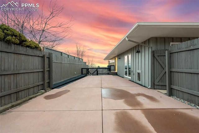 view of patio terrace at dusk