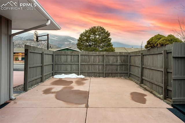 patio terrace at dusk with a mountain view