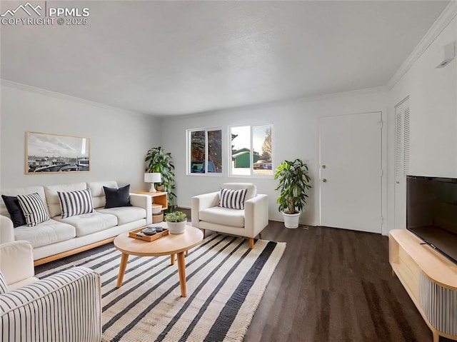 living room featuring ornamental molding and dark hardwood / wood-style floors