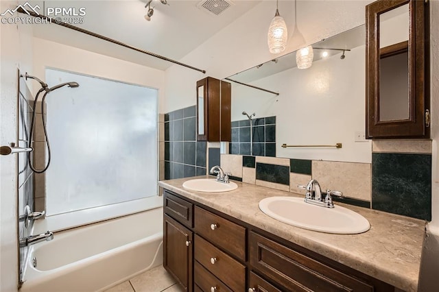 bathroom with vanity, decorative backsplash, bathtub / shower combination, and tile patterned floors