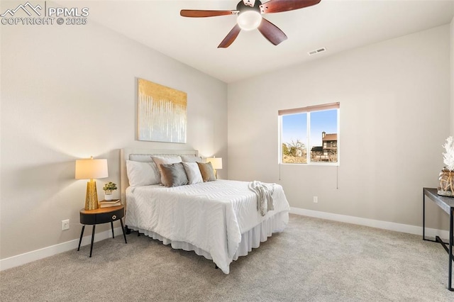 bedroom featuring ceiling fan and light carpet