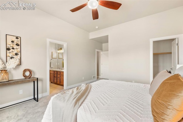 carpeted bedroom featuring ceiling fan and ensuite bathroom