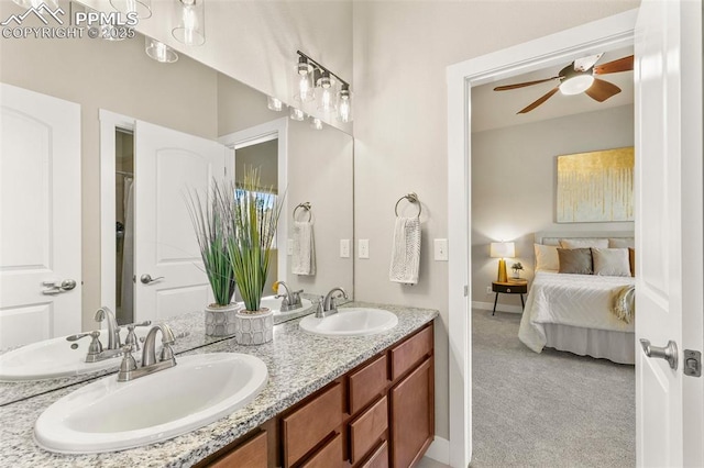 bathroom with ceiling fan and vanity