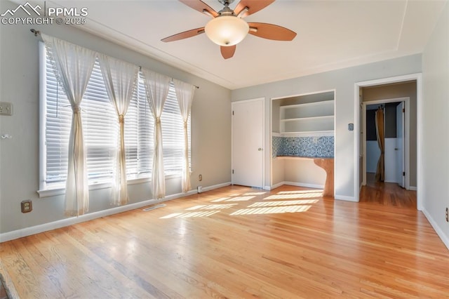 unfurnished bedroom featuring ceiling fan and light wood-type flooring