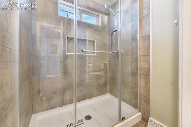 bathroom featuring an enclosed shower