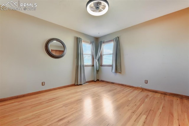 spare room featuring light wood-type flooring