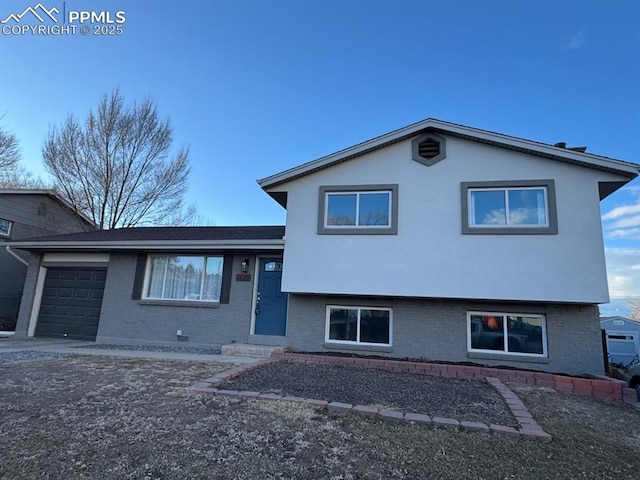 split level home featuring a garage