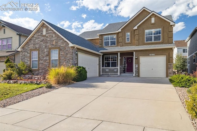 craftsman inspired home featuring a garage and covered porch