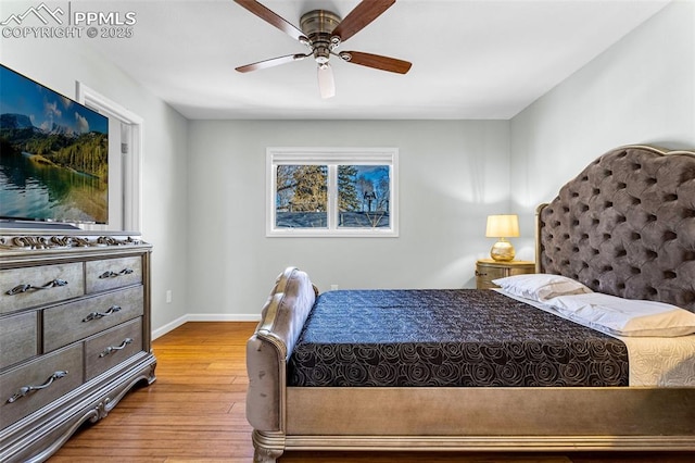 bedroom featuring ceiling fan and hardwood / wood-style floors