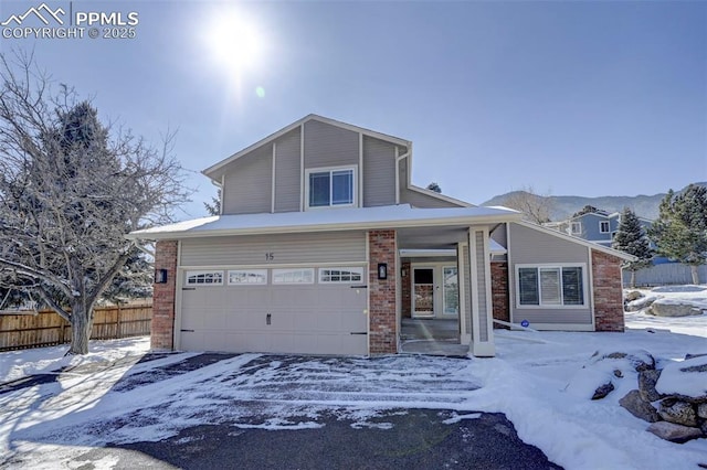 view of front of house featuring a mountain view and a garage