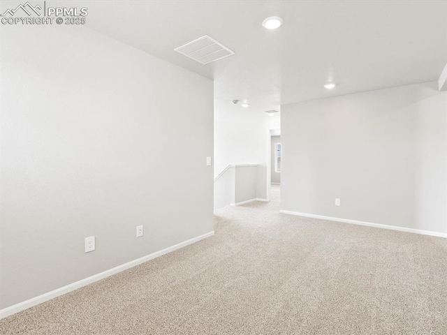 spare room with recessed lighting, visible vents, baseboards, and carpet flooring