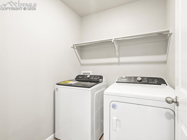 laundry area featuring laundry area, baseboards, and separate washer and dryer