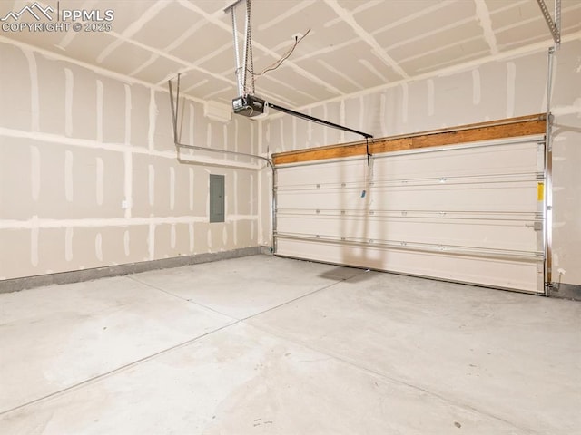 garage with electric panel and a garage door opener