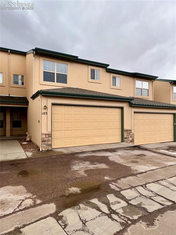 view of front of property with a garage