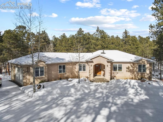 view of front of house featuring stucco siding