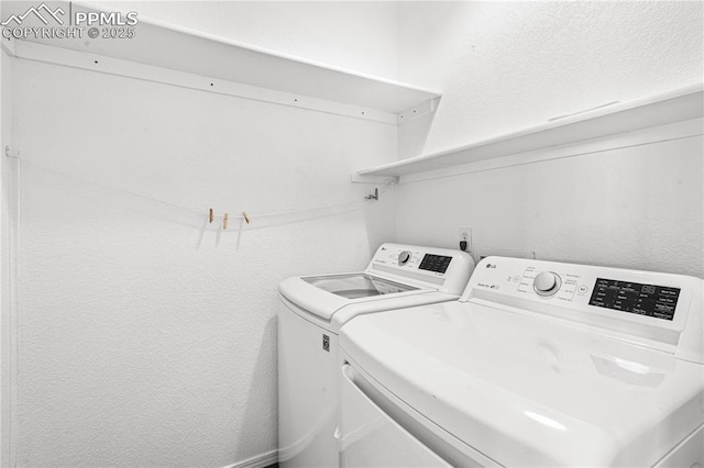 laundry room with washing machine and dryer