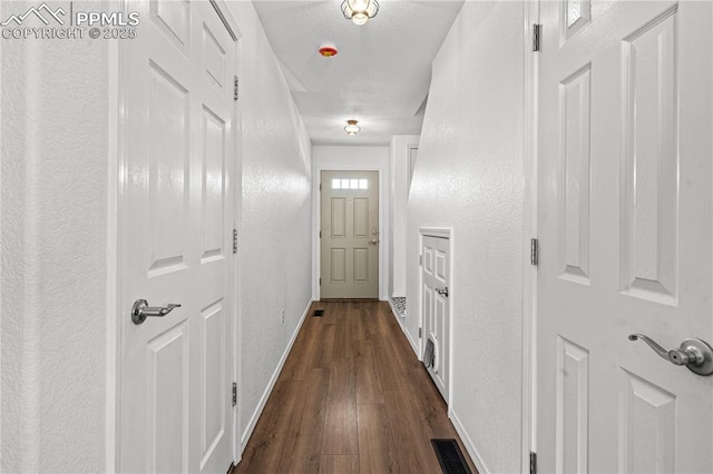 hall with dark hardwood / wood-style floors