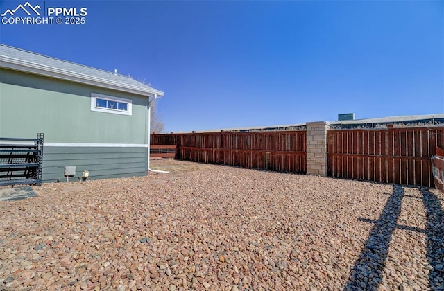 view of yard with fence