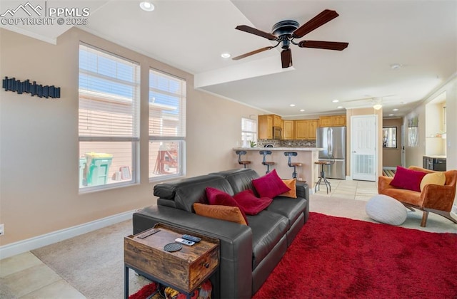 living room with ceiling fan, ornamental molding, recessed lighting, and baseboards