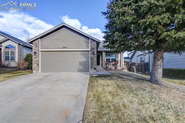 single story home featuring a front yard and a garage