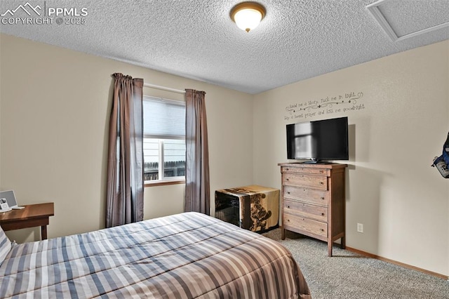 carpeted bedroom featuring a textured ceiling