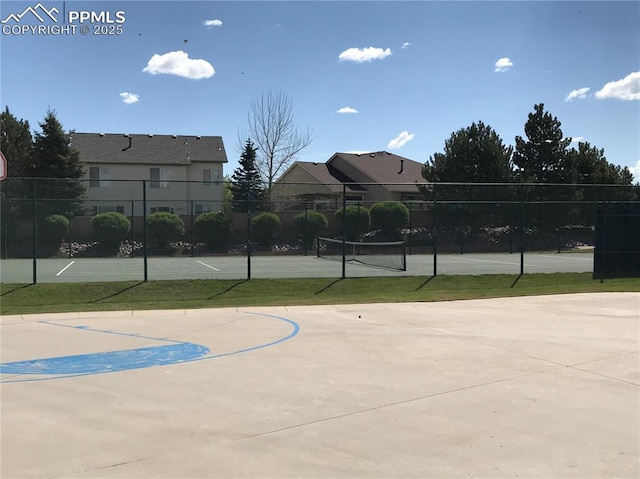 view of sport court featuring tennis court