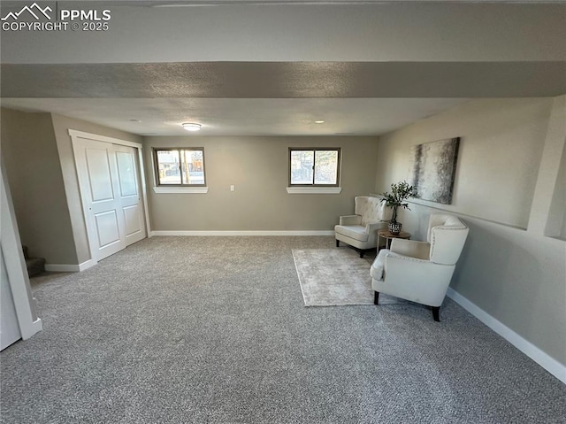 unfurnished room with stairway, carpet flooring, a textured ceiling, and baseboards