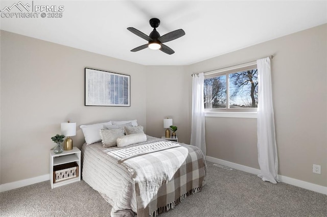 bedroom with a ceiling fan, carpet, and baseboards