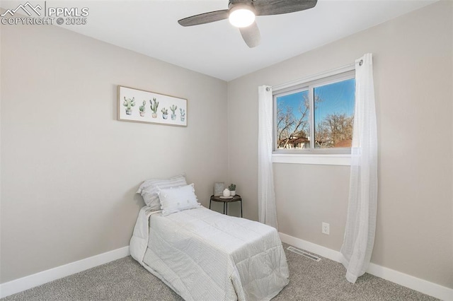 carpeted bedroom with visible vents, ceiling fan, and baseboards