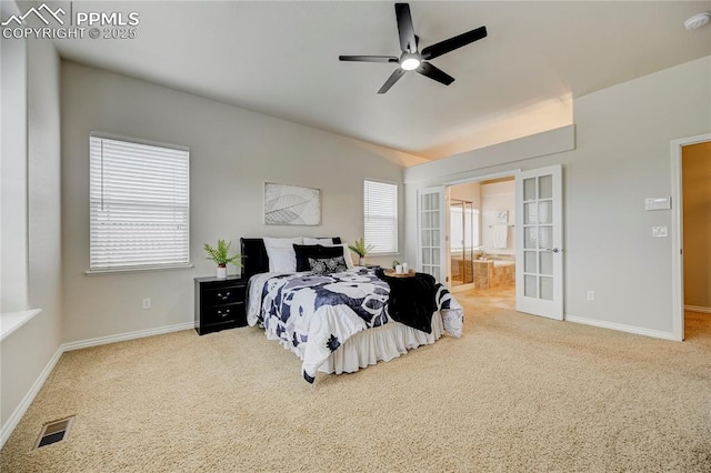 carpeted bedroom featuring french doors, visible vents, vaulted ceiling, and multiple windows