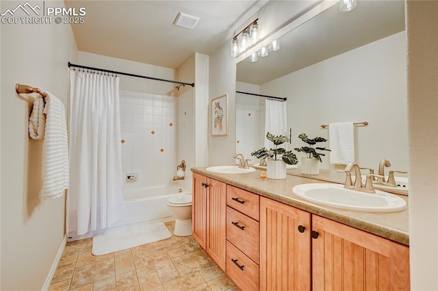 full bath featuring shower / bath combination with curtain, visible vents, a sink, and double vanity