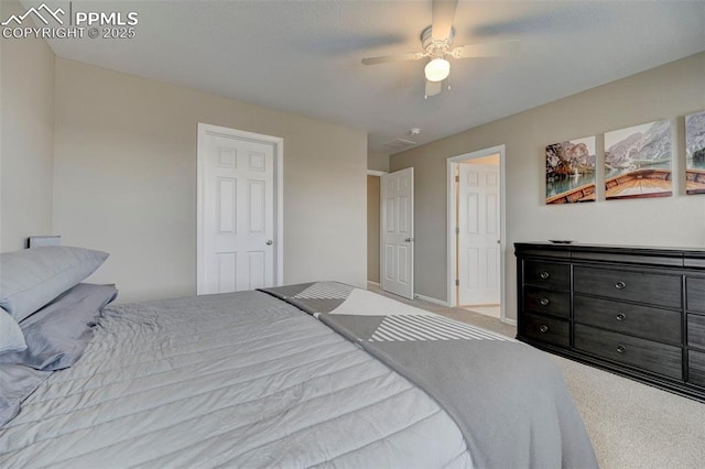 carpeted bedroom with ceiling fan