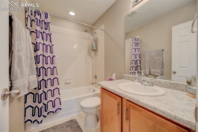 full bathroom featuring vanity, shower / bath combo, and toilet