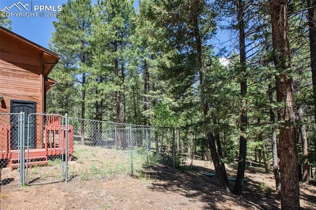 view of yard featuring a gate and fence