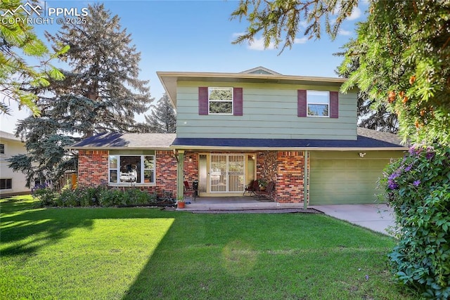2113 Woodburn St, Colorado Springs, CO 80906 - traditional-style home with driveway, a garage, brick siding, and a front yard