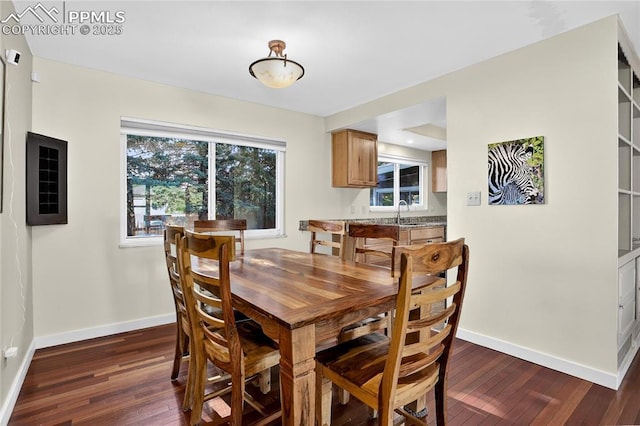 2113 Woodburn St, Colorado Springs, CO 80906 - dining area with dark wood finished floors and baseboards