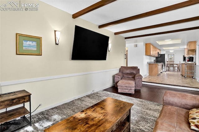 2113 Woodburn St, Colorado Springs, CO 80906 - living area featuring beamed ceiling and light wood-type flooring