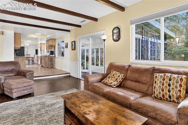 2113 Woodburn St, Colorado Springs, CO 80906 - living area with dark wood finished floors, beam ceiling, and a wainscoted wall