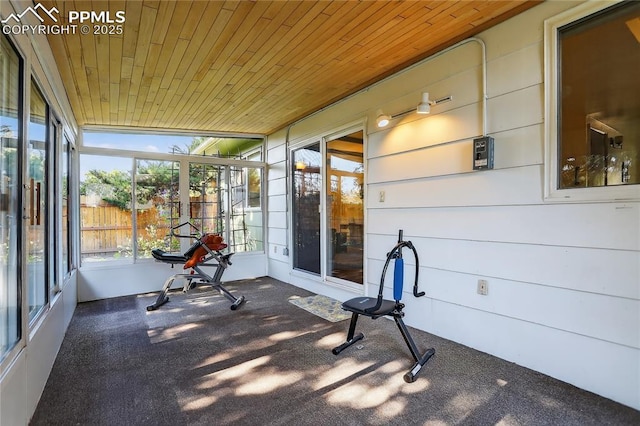 2113 Woodburn St, Colorado Springs, CO 80906 - unfurnished sunroom with carpet flooring and wooden ceiling