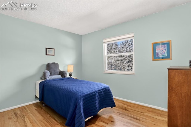 2113 Woodburn St, Colorado Springs, CO 80906 - bedroom featuring baseboards and wood finished floors