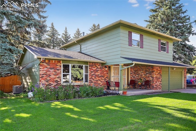 2113 Woodburn St, Colorado Springs, CO 80906 - view of front of home with brick siding, a garage, driveway, and a porch