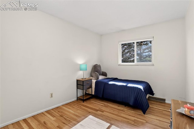 2113 Woodburn St, Colorado Springs, CO 80906 - bedroom with wood finished floors and baseboards