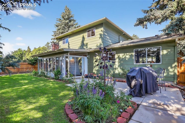 2113 Woodburn St, Colorado Springs, CO 80906 - back of house featuring a patio and a sunroom