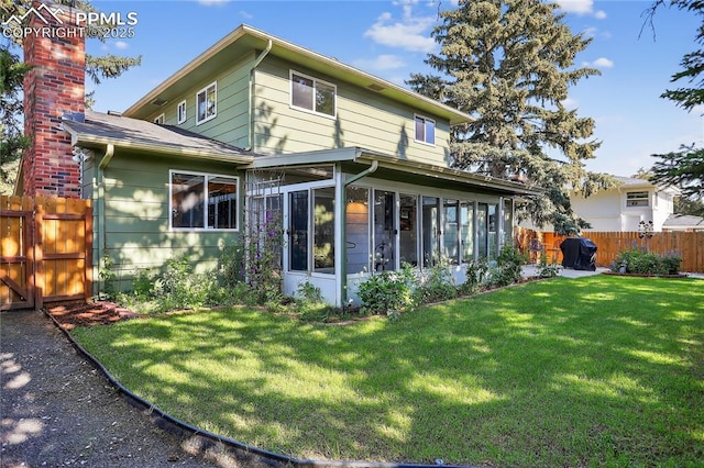 2113 Woodburn St, Colorado Springs, CO 80906 - back of property with a sunroom and a chimney