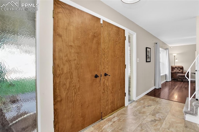 2113 Woodburn St, Colorado Springs, CO 80906 - entryway with baseboards and stairs