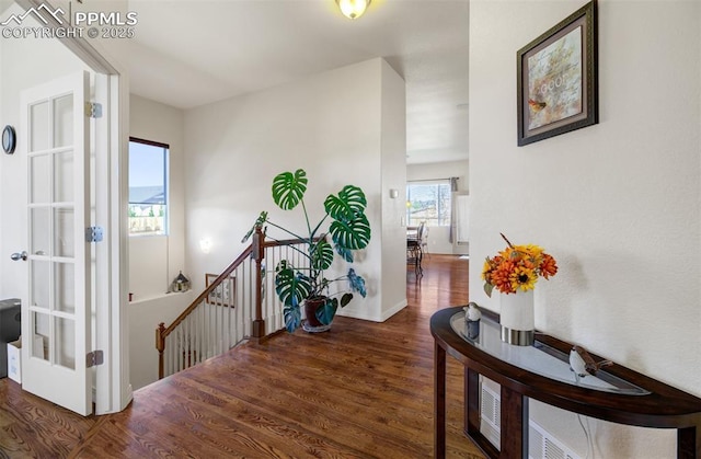 hall with dark hardwood / wood-style flooring