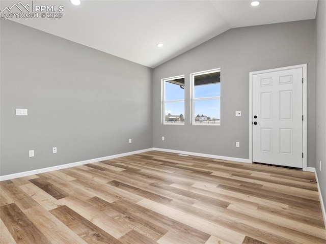 unfurnished room featuring baseboards, recessed lighting, vaulted ceiling, and light wood-style floors