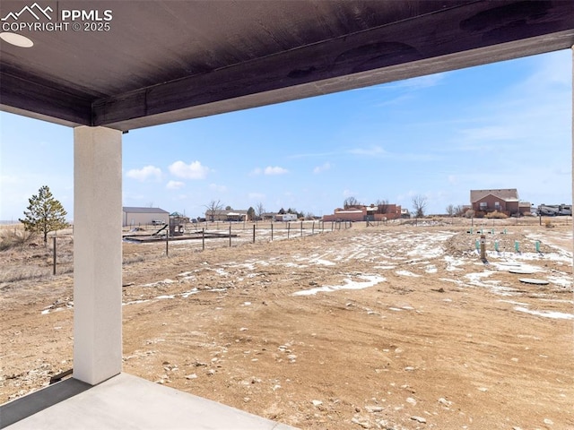 view of yard with a rural view